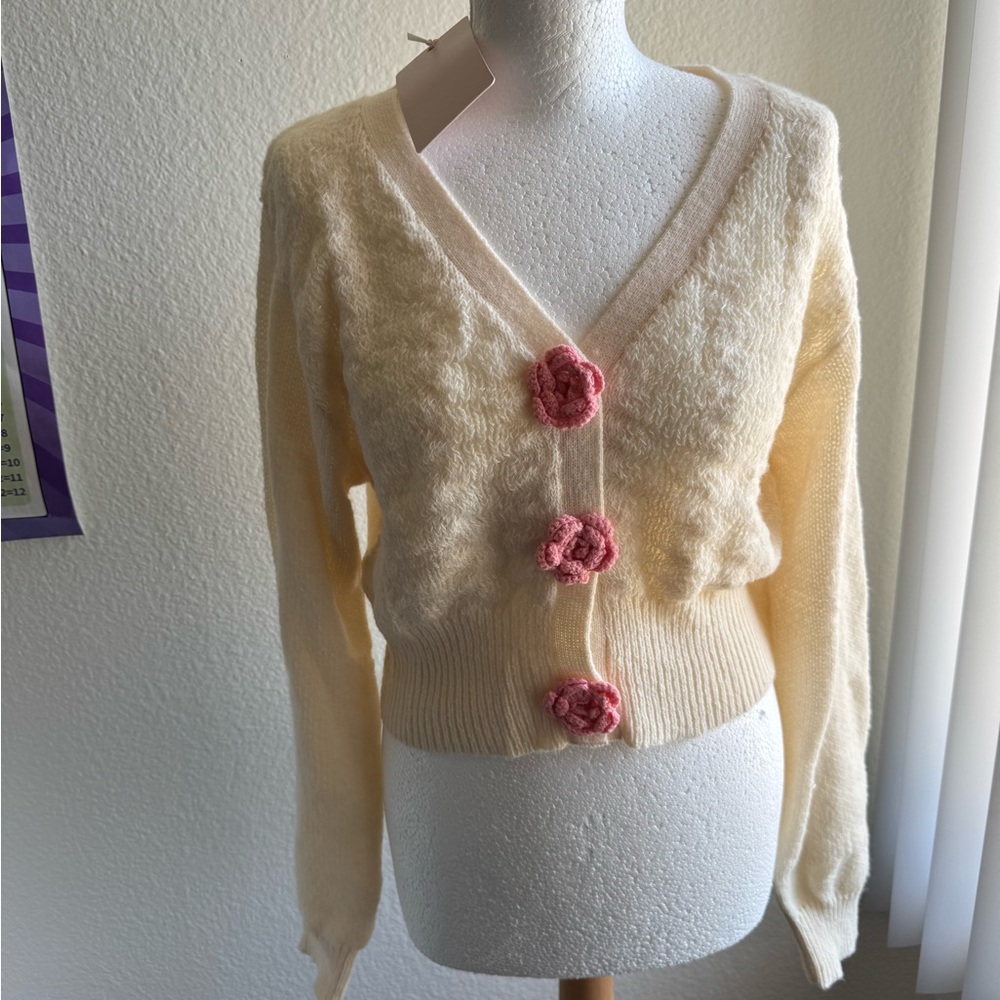Brand new, Cream Sweater with Pink crochet flower Accents.